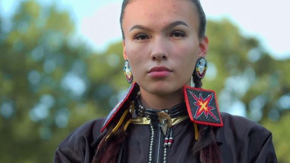 Native American teen looking at the camera