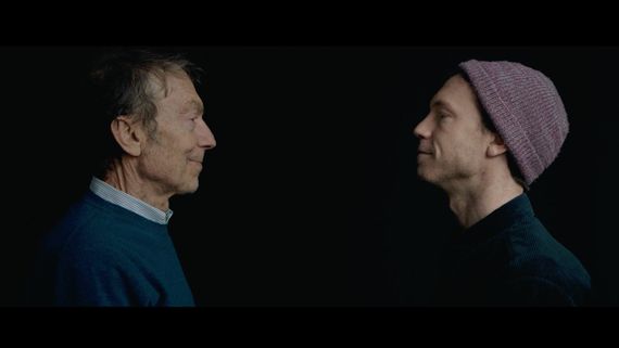 Old man and young man facing each other