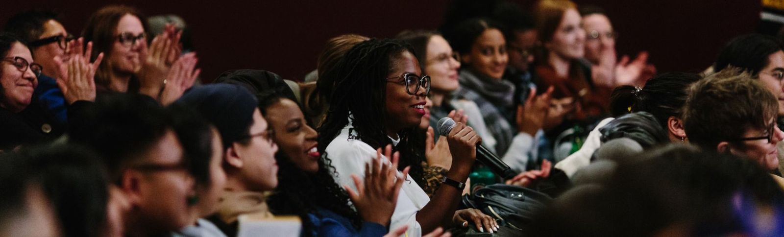 a photo of the audience in a movie theatre