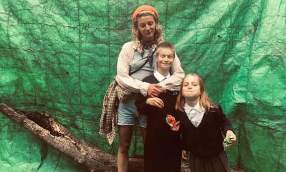 a woman and two young kids