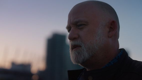 Closeup of man with goatee at sunset