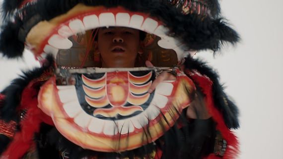 someone in a lion dancing costume