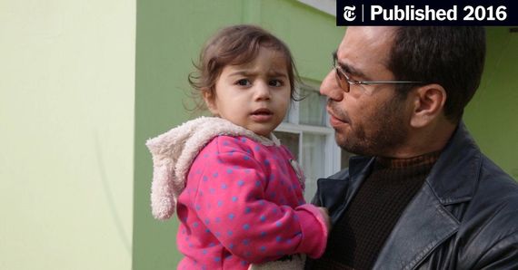 a man holding a young child