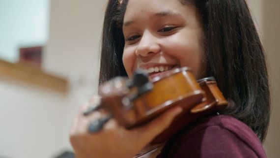 a young musician playing the violin