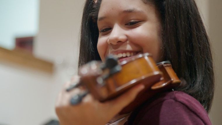 a young musician playing the violin