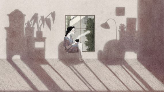 shadows of furniture against a woman sitting in a window