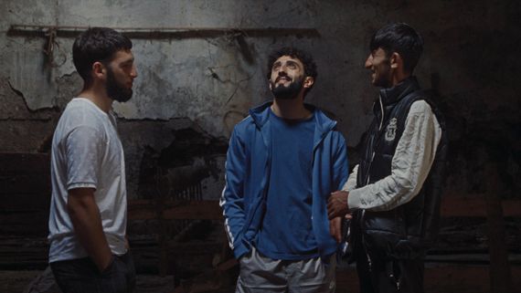 3 men standing in a semicircle