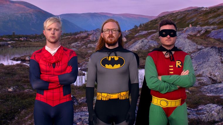 three men dressed as spider man, batman and robin