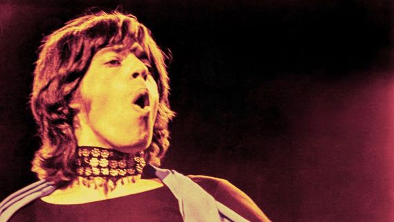 Mick Jagger in a choker singing