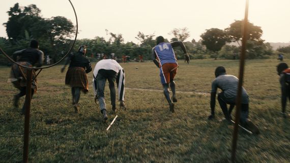 a group of people playing quidditch in uganda