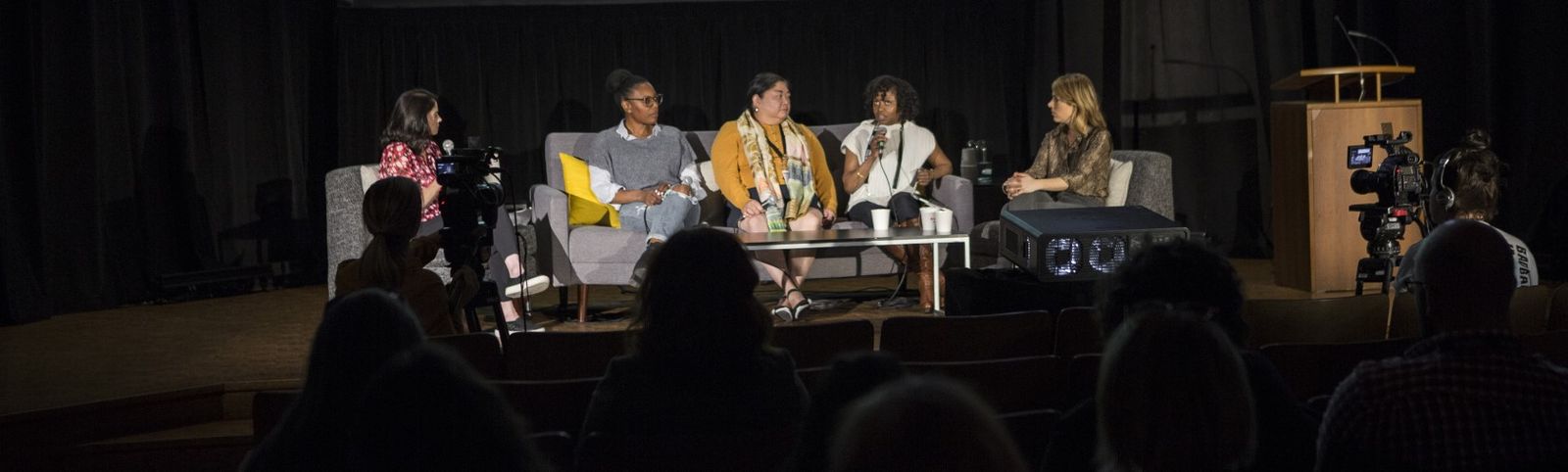 Conference speakers sitting on couch