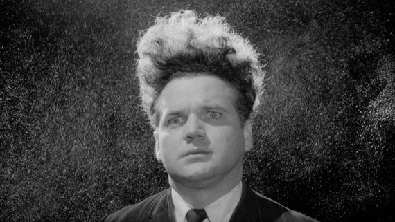 black and white image of a man with tall hair