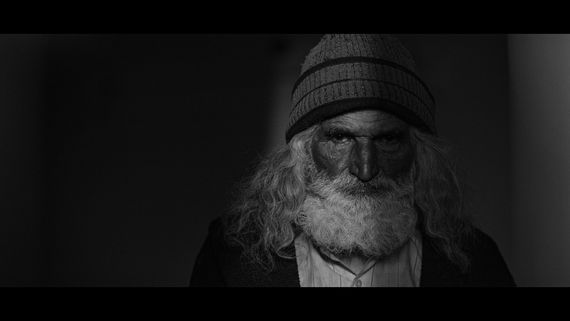 Closeup of old man in shadow