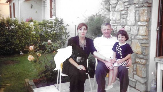 Old family portrait of man, woman and little girl